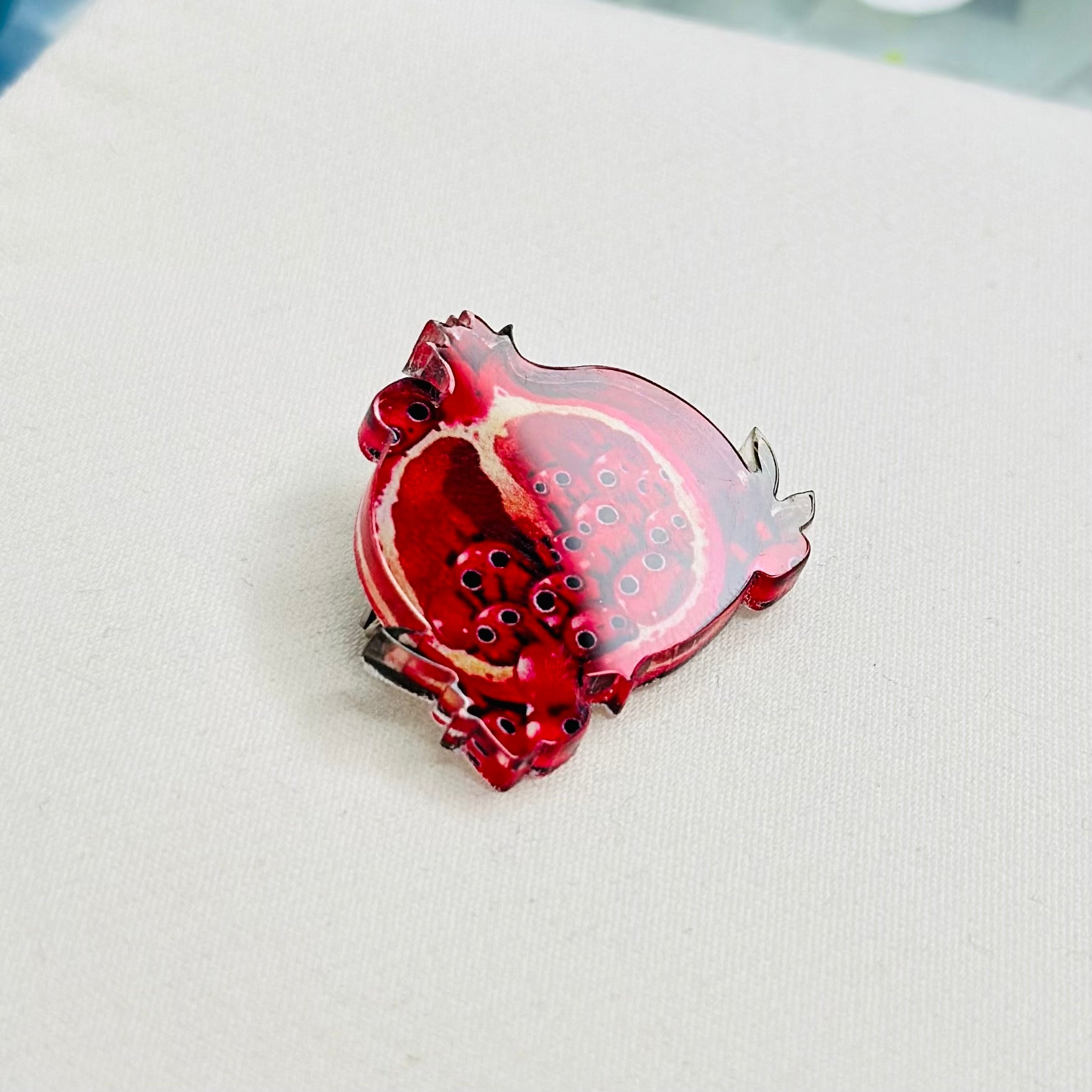 Garnet glass brooch