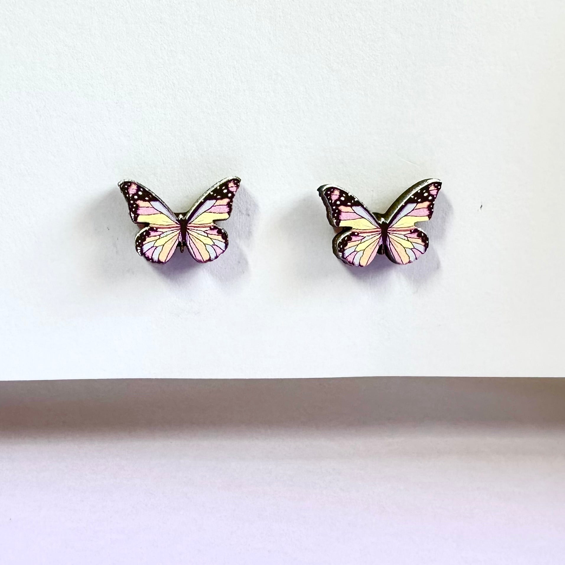 Pink butterfly wooden earring with pastel colors