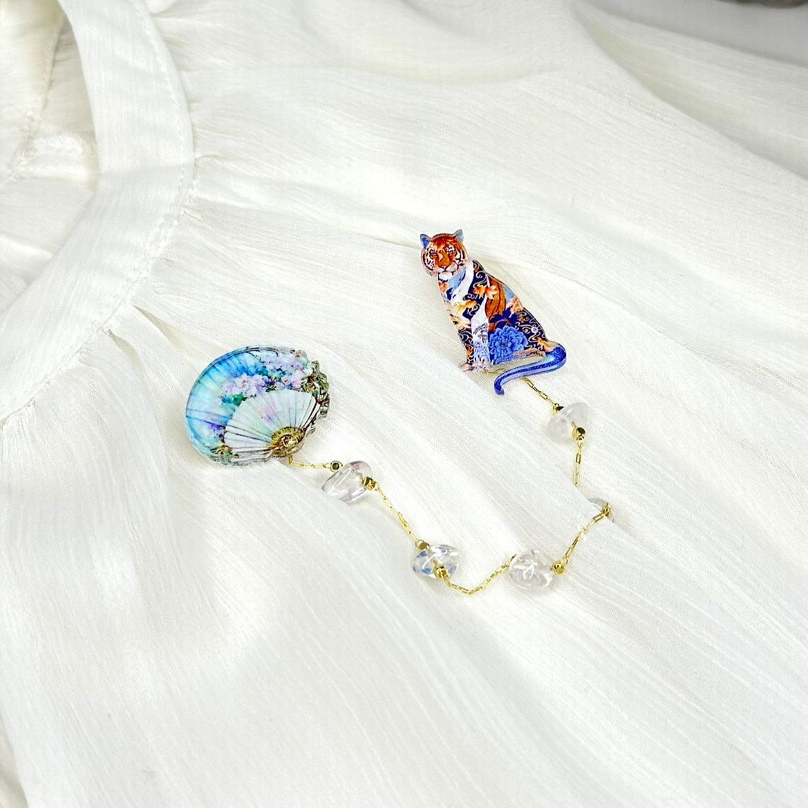 Japanese Style Tiger and Marao with Flowers: Organic glass brooch with natural white mountain crystal stones