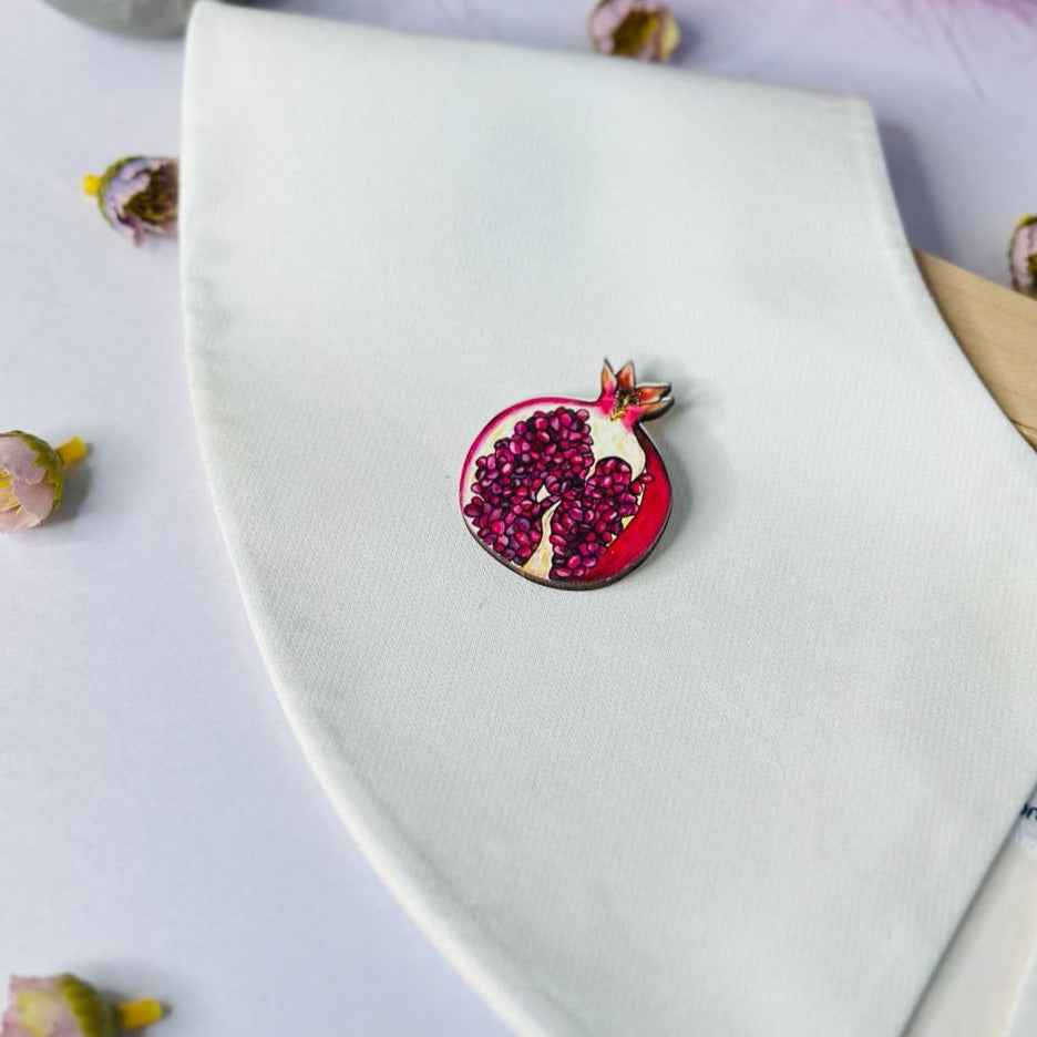 Red pomegranate brooch