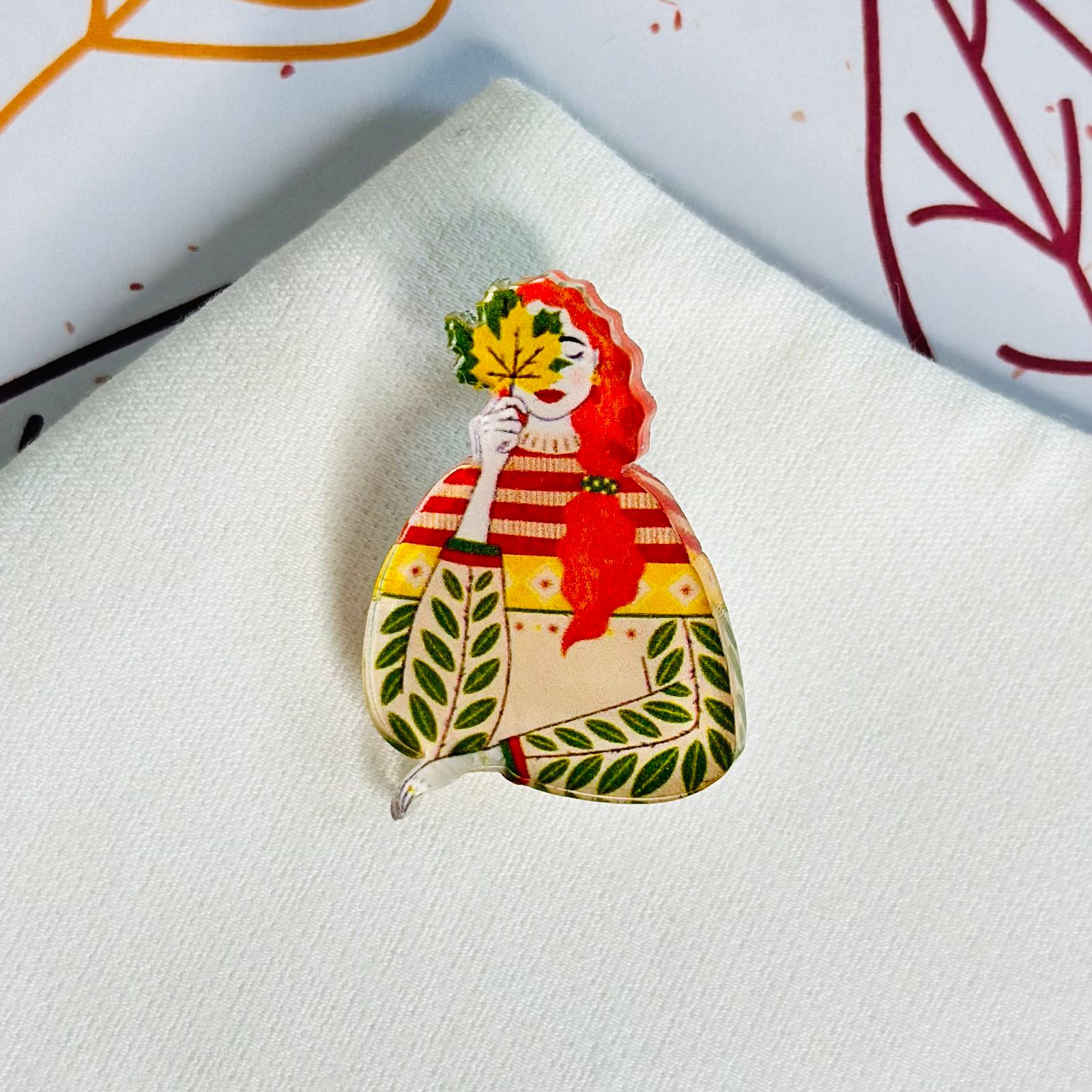 Girl with autumn leaf glass brooch