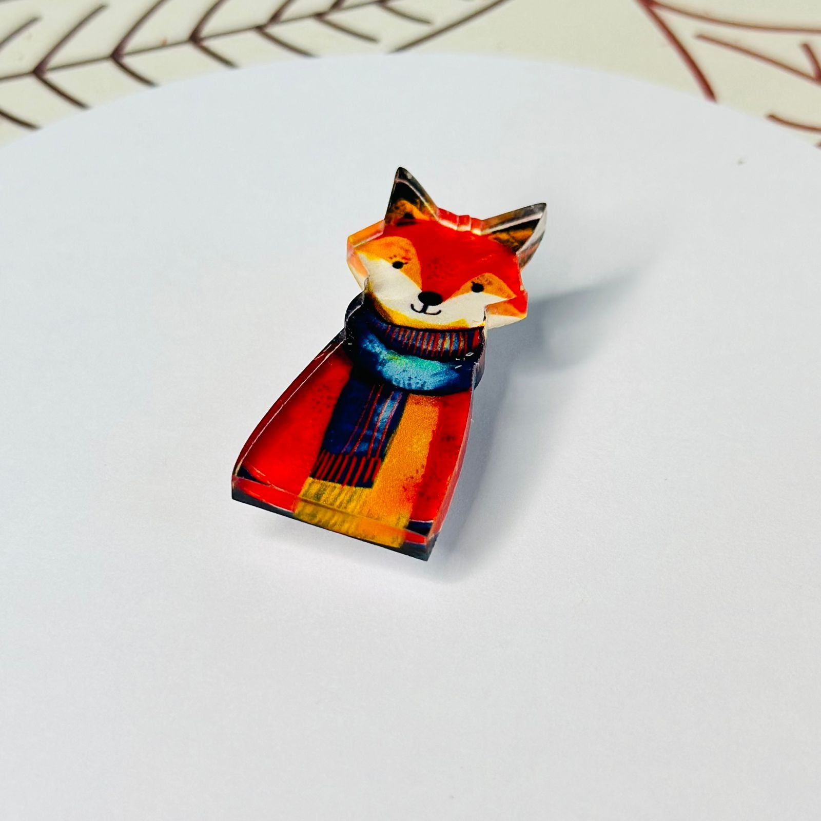 Fox colored amber glass brooch