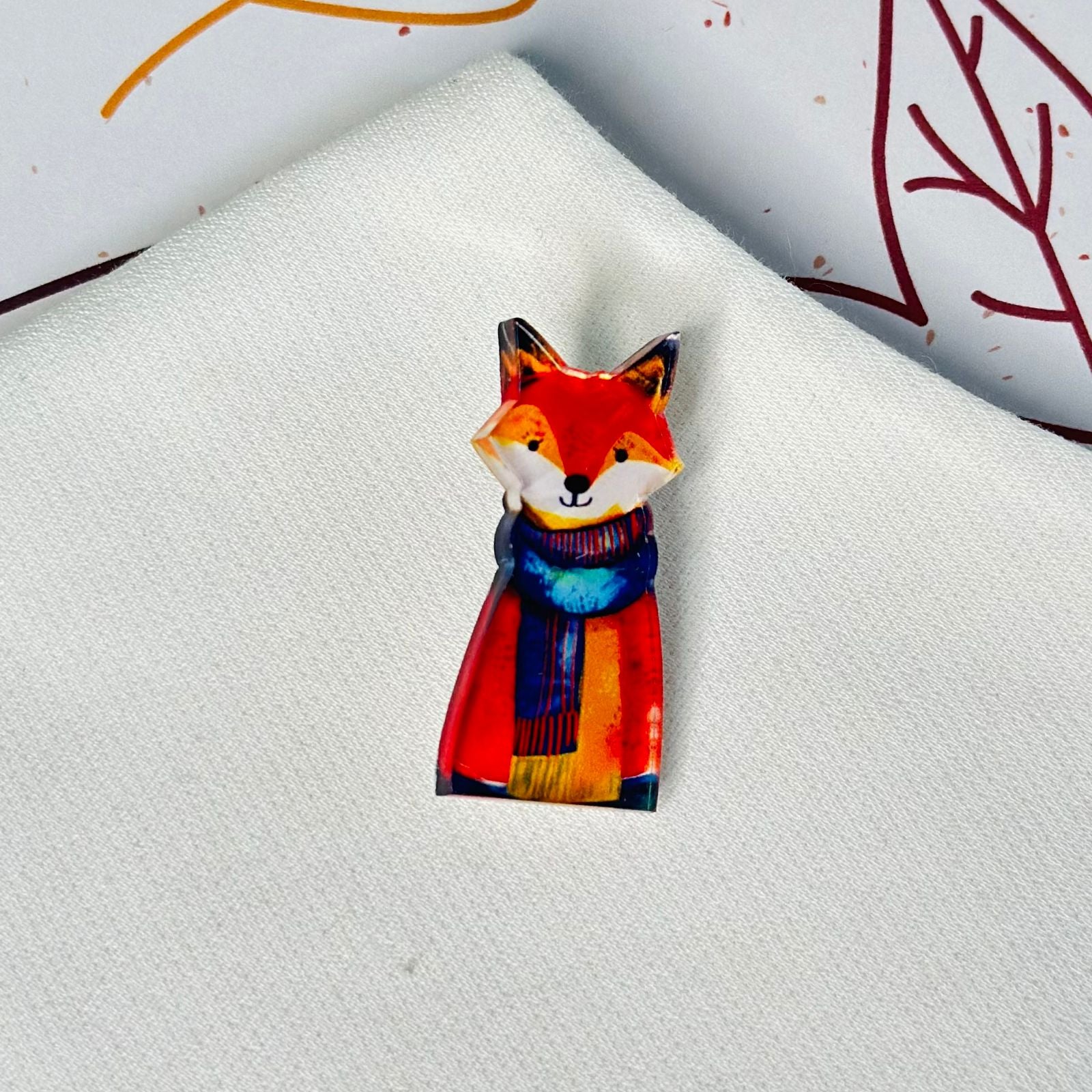 Fox colored amber glass brooch