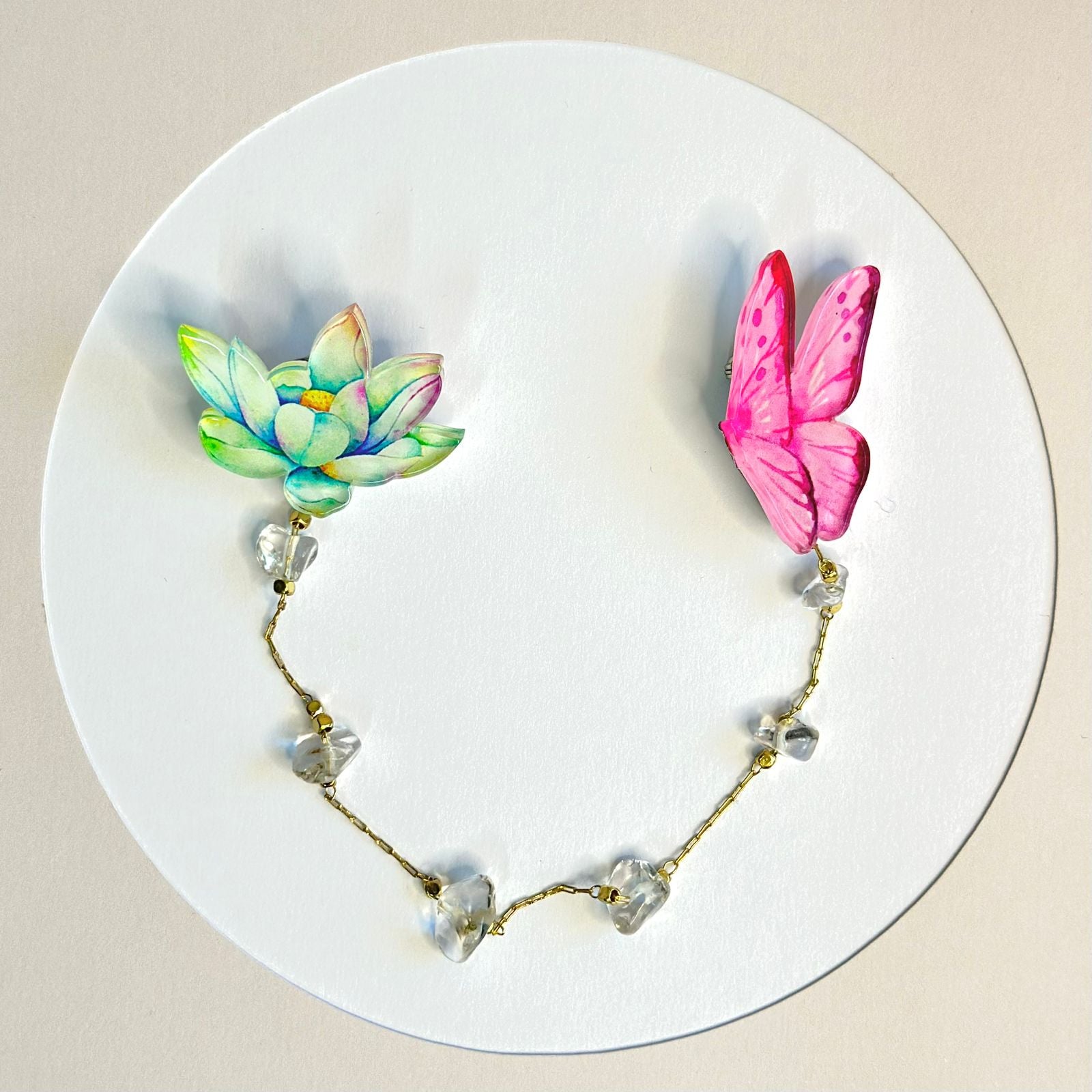 Lotus and Pink Butterfly: Organic glass brooch with natural white rock crystal stones